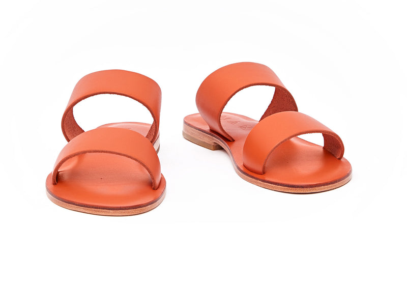 Front view of the handmade Sun women's slip-on leather sandals in orange / ORANGE