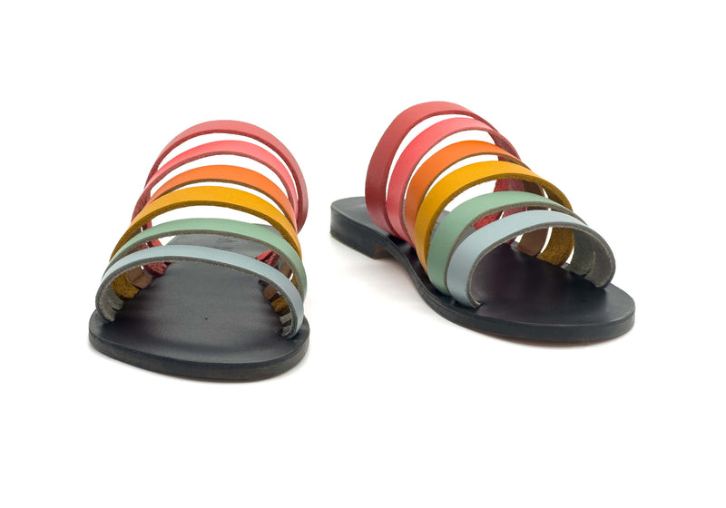 Front view of the handmade Sunshine women's slip-on leather sandals in black insole with rainbow straps / RAINBOW