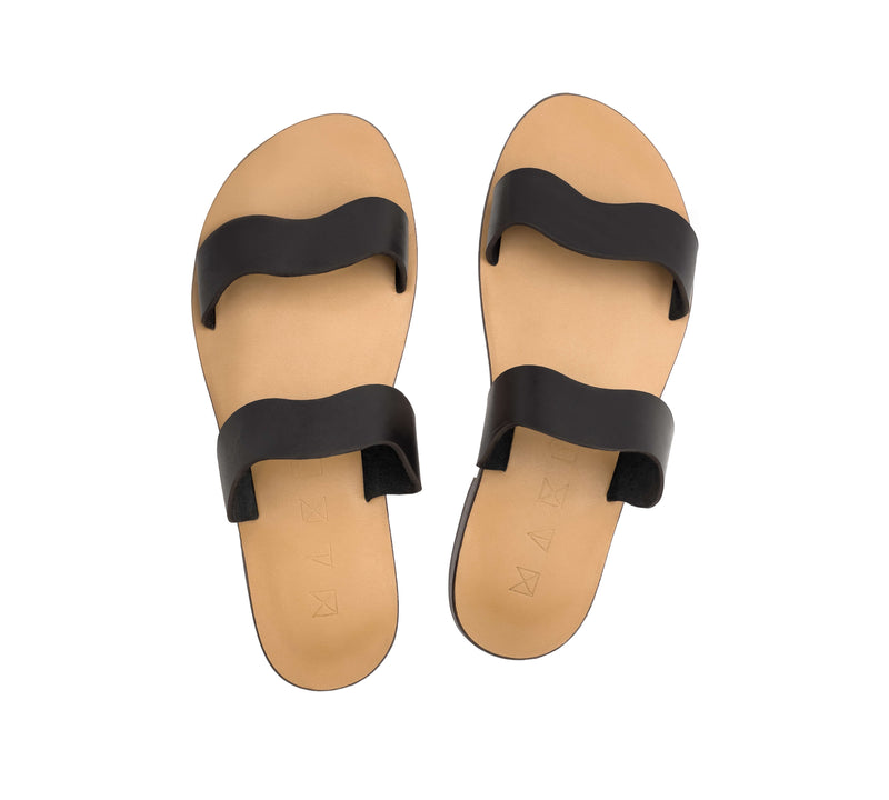 Top view of the handmade Mare women's slip-on leather sandals with tan insoles and black straps / BLACK