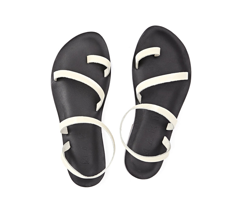 Top view of the handmade Moon women's slingback leather sandals in black insole with cream straps / CREAM BLACK