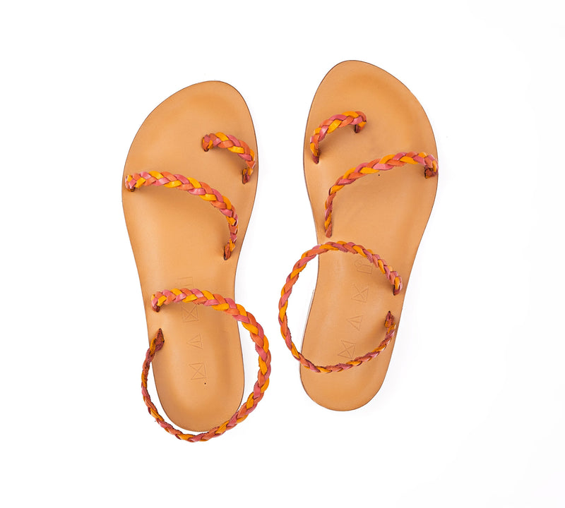 Top view of the handmade Salt women's braided slingback leather sandals in natural tan insole with pomegranate, orange and yellow straps / SUNSET