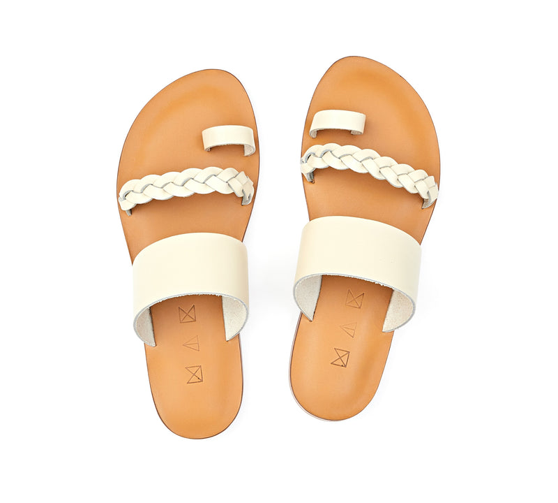 Top view of the handmade Salt women's braided slip-on leather sandals in natural tan insole with cream straps / CREAM