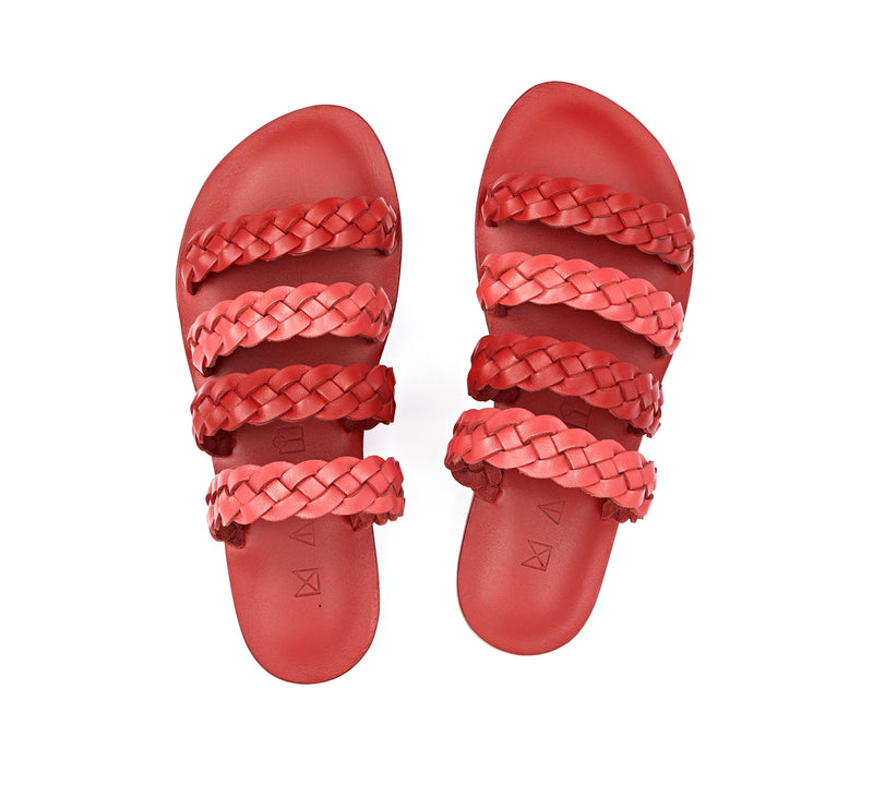 Top view of the handmade Sea women's braided slip-on leather sandals in red insole with pomegranate and red straps / RED POMEGRANATE
