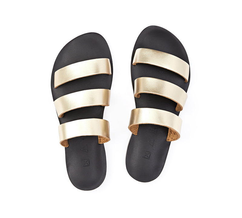 Top view of the handmade Sky women's slip-on leather sandals in black insole with gold straps / GOLD BLACK