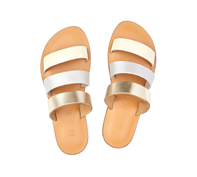 Top view of the handmade Sky women's slip-on leather sandals in natural tan insole with gold, silver and cream straps / MOONLIGHT