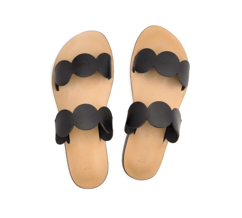 Top view of the handmade Sol women's slip-on leather sandals with tan insoles and black straps / BLACK