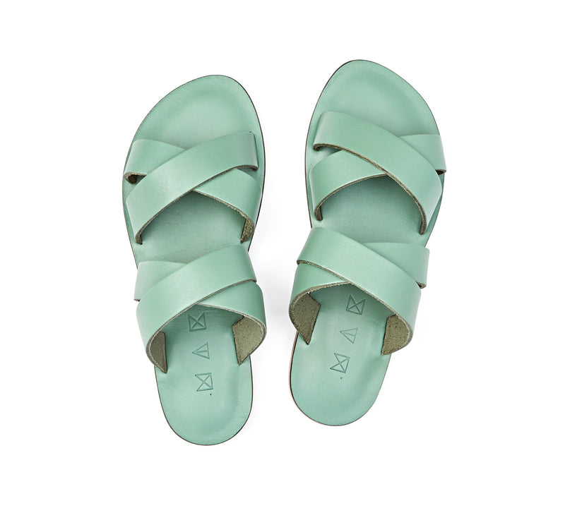 Top view of the handmade Wave women's slip-on leather sandals in light green / GREEN