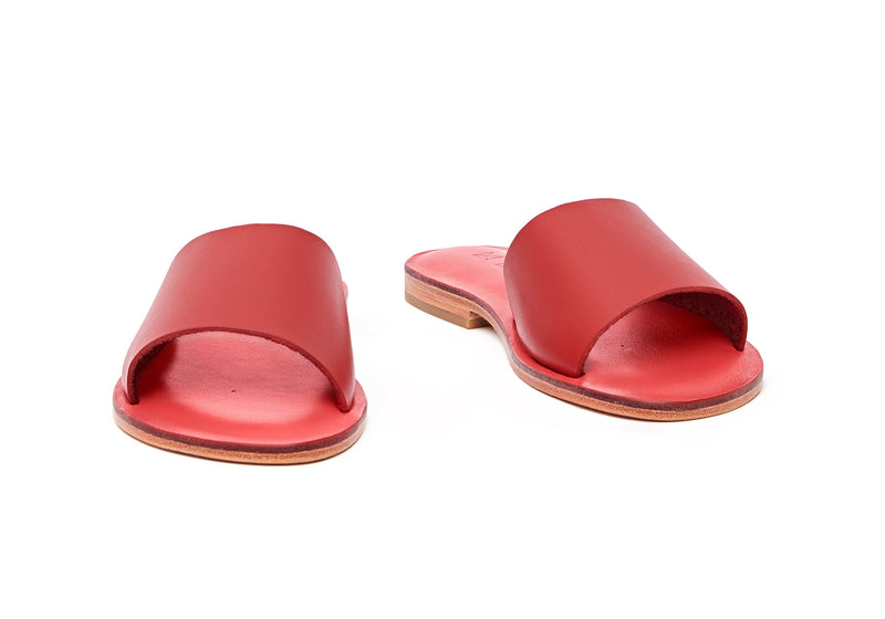 Front view of the handmade Rock women's slip-on leather sandals in pomegranate insole with  red straps / RED