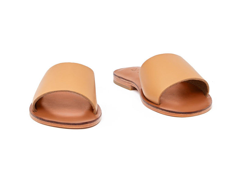 Front view of the handmade Rock women's slip-on leather sandals in light brown insole with natural tan straps / TAN