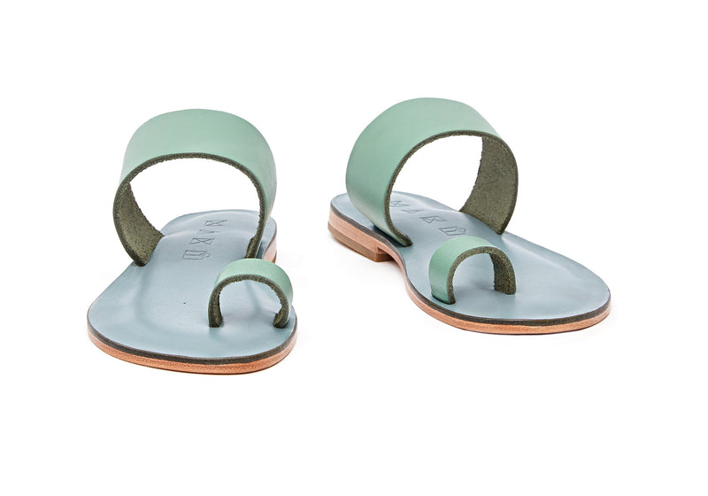 Front view of the handmade Root women's slip-on leather sandals in light grey insole with light green straps / GREEN