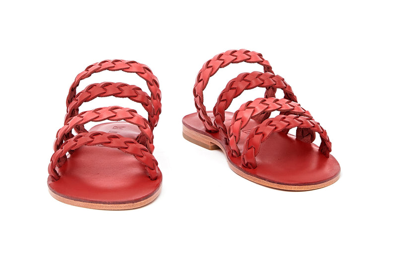 Front view of the handmade Sea women's braided slip-on leather sandals in red insole with pomegranate and red straps / RED POMEGRANATE