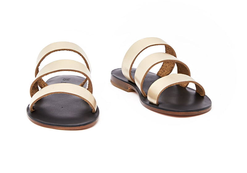 Front view of the handmade Sky women's slip-on leather sandals in black insole with gold straps / GOLD BLACK