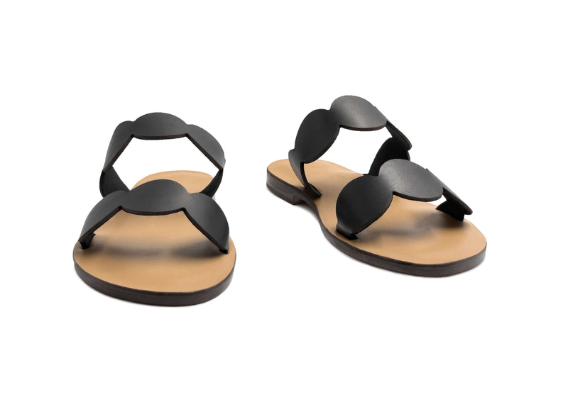 Front view of the handmade Sol women's slip-on leather sandals with tan insoles and black straps / BLACK