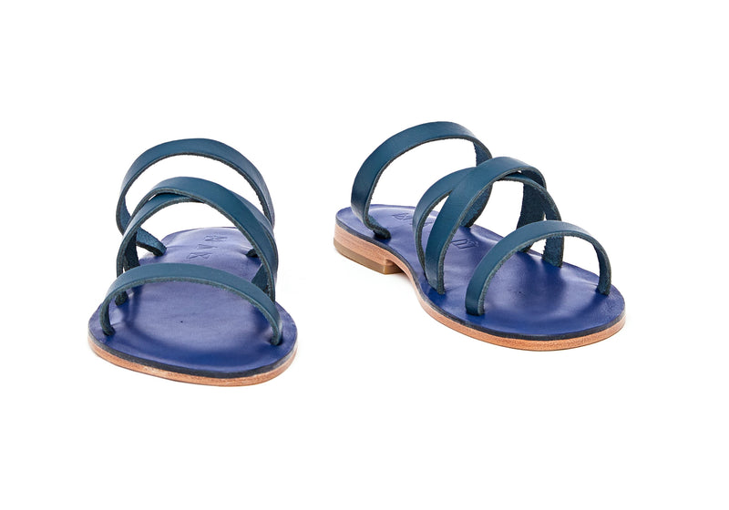 Front view of the handmade Wind women's slip-on leather sandals in night blue / MEDITERRANEAN