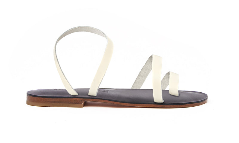 Side view of the handmade Moon women's slingback leather sandals in black insole with cream straps / CREAM BLACK