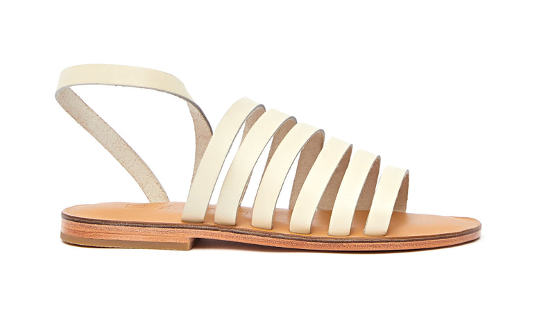 Side view of the handmade Ray women's slingback leather sandals in natural tan insole with cream straps / CREAM