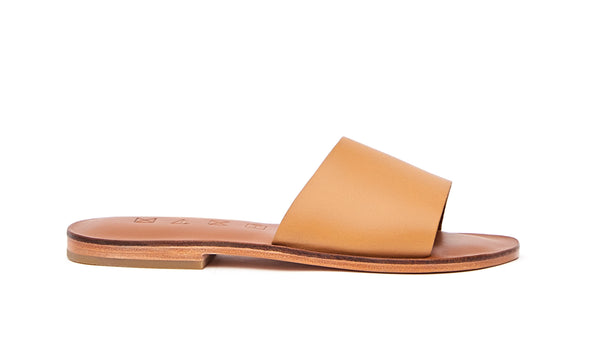 Side view of the handmade Rock women's slip-on leather sandals in light brown insole with natural tan straps / TAN