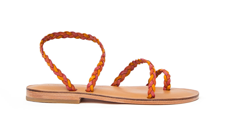 Side view of the handmade Salt women's braided slingback leather sandals in natural tan insole with pomegranate, orange and yellow straps / SUNSET