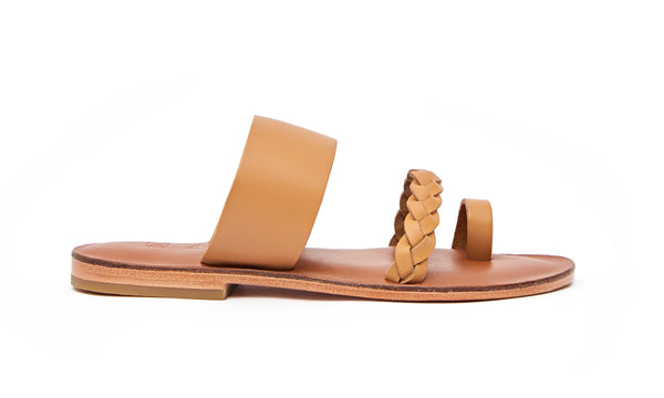 Side view of the handmade Sand women's braided slip-on leather sandals in light brown insole with natural tan straps / TAN