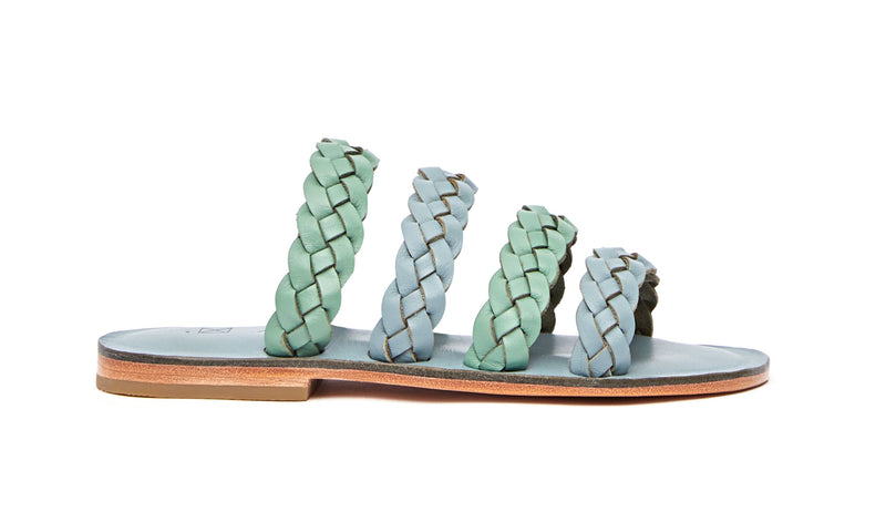 Side view of the handmade Sea women's braided slip-on leather sandals in light grey insole with light green and grey straps / GREY GREEN