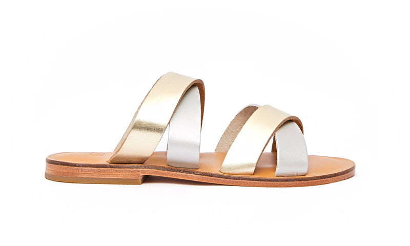 Side view of the handmade Wave women's slip-on leather sandals in natural tan insole with gold and silver straps / GOLD SILVER