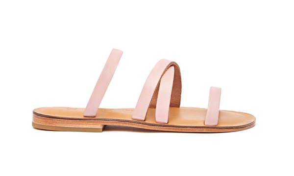 Side view of the handmade Wind women's slip-on leather sandals in natural tan insole with light pink straps / PINK