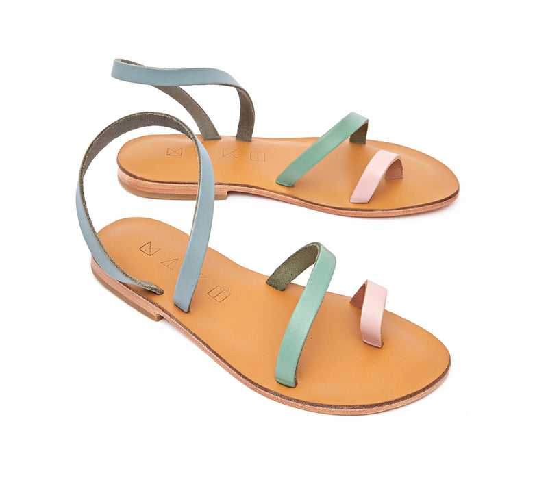 Angled view of the handmade Moon women's slingback leather sandals in natural tan insole with light pastel pink green and grey straps / PASTEL