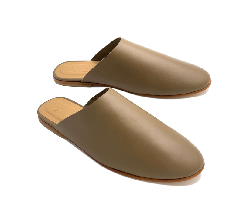 Angled view of the handmade Mule women's slip-on leather sandals in olive / OLIVE