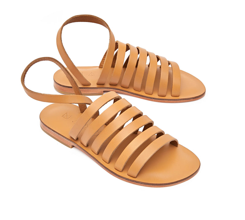 Angled view of the handmade Ray women's slingback leather sandals in natural tan / TAN