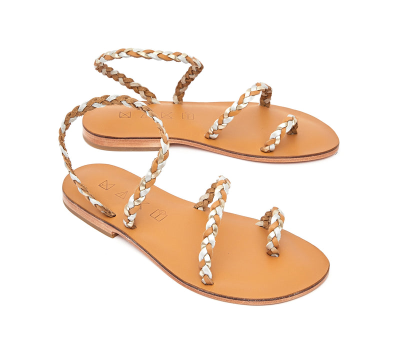 Angled view of the handmade Salt women's braided slingback leather sandals in natural tan insole with gold, silver and natural tan straps / GOLD SILVER