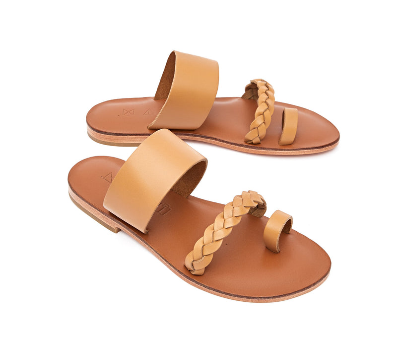 Angled view of the handmade Salt women's braided slip-on leather sandals in light brown insole with natural tan straps / TAN