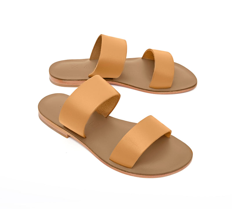 Angled view of the handmade Sun women's slip-on leather sandals in olive insole with natural tan straps / TAN